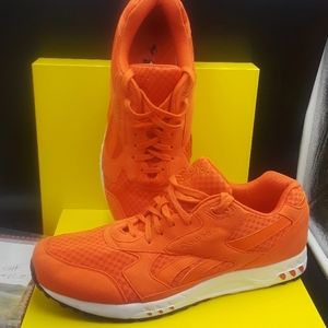 Orange  and white Reebok's sneakers